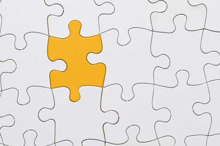 ncomplete white puzzle with one missing piece highlighted in yellow, symbolizing unfinished work or tasks not yet done.
